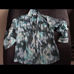 Beautiful long sleeve blouse with button up sleeve